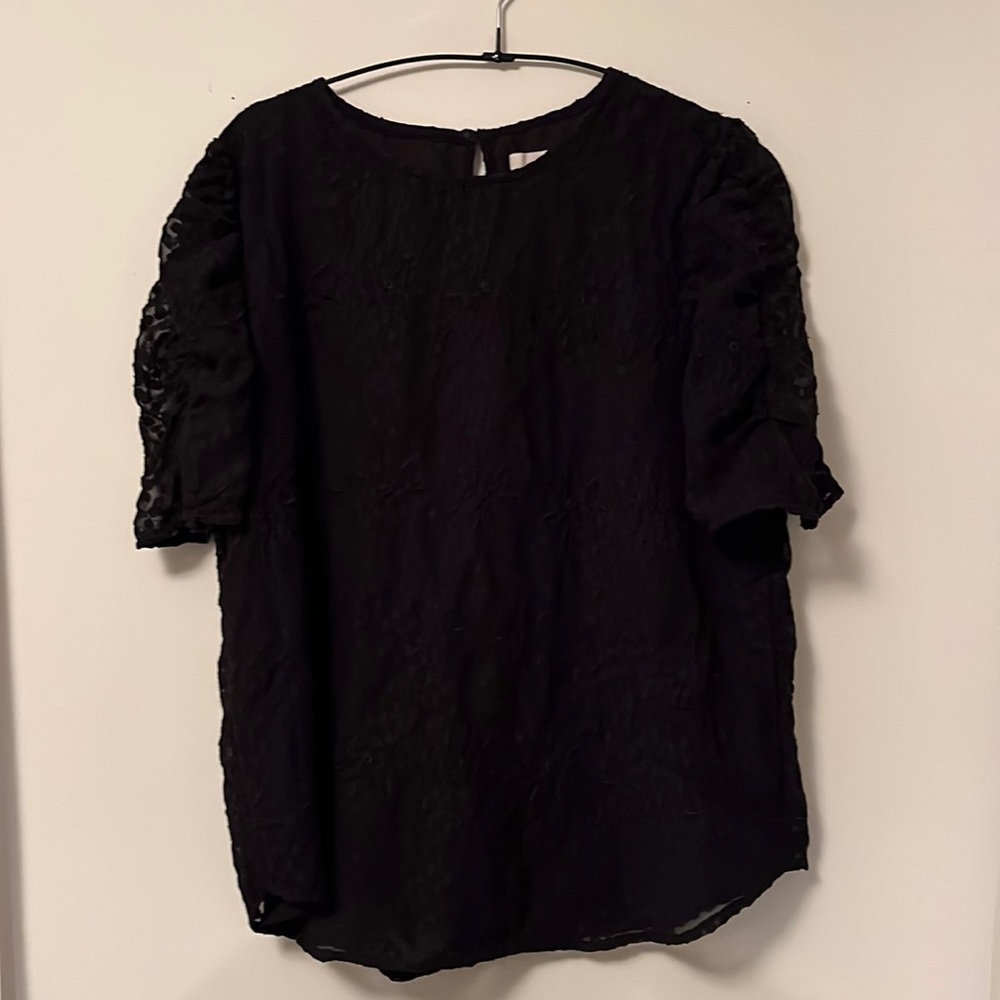 Black top with lace like eyelets